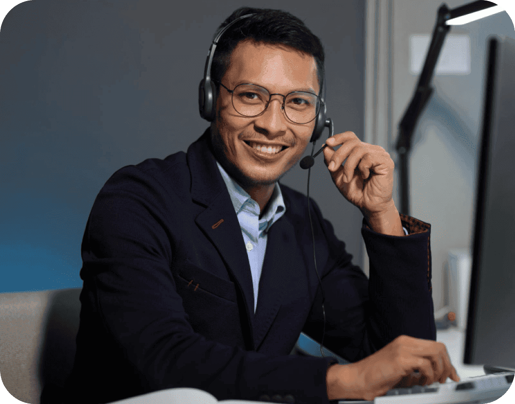 Professional support representative with headset assisting at computer