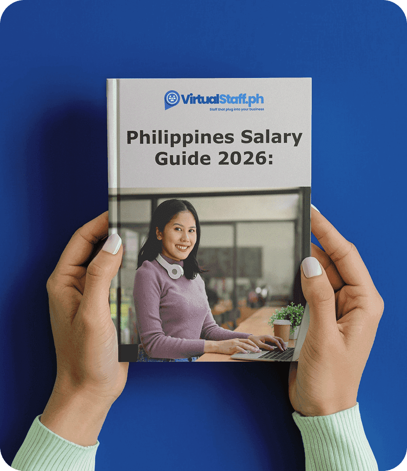 Hands holding the Philippines Salary Guide 2026